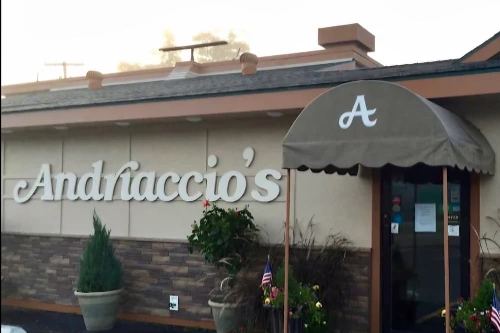 Exterior of Andriaccio's restaurant with a marquee and entrance awning.
