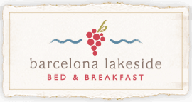Logo for Barcelona Lakeside Bed & Breakfast featuring grapes and waves.