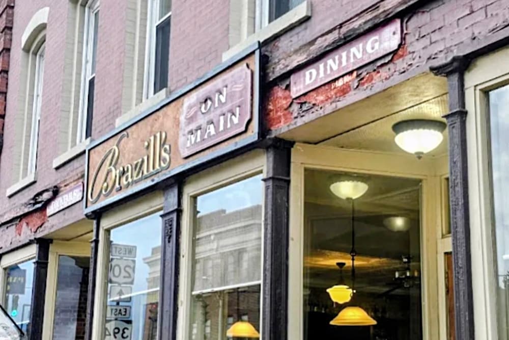 Signage for "Brazill's On Main" with a window view of the dining area.