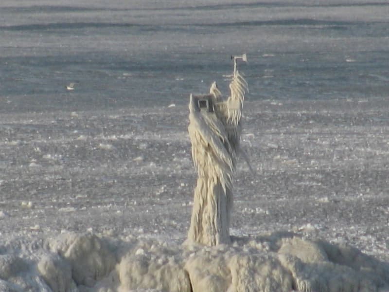 Abstract image featuring horizontal gray lines with a yellow stripe at the top and a gray background.